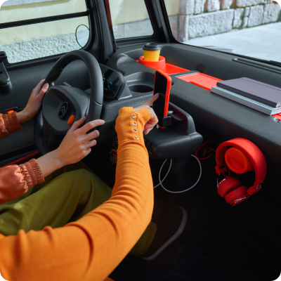 Interior view of Ami cockpit with secure durable protective layout supporting innovative connected urban driving accessories.